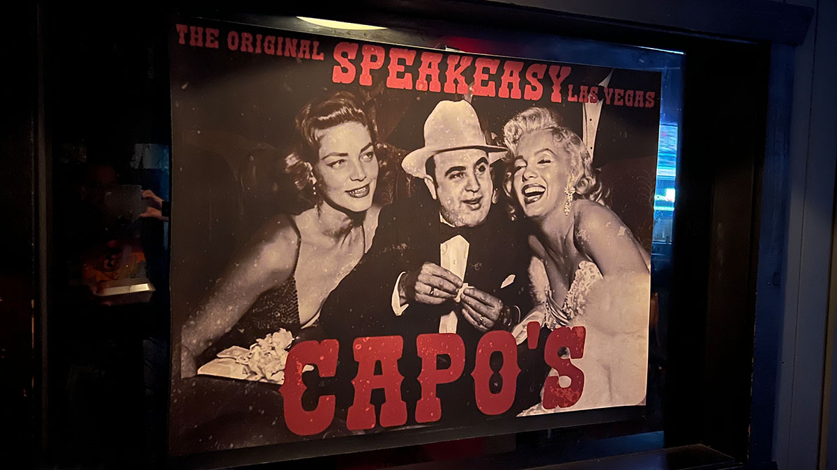 Al Capone and Marylin Monroe Poster showing Capos - The Orginal Speakeasy in Las Vegas