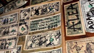 Signed dollar bills all over the walls of mountain springs saloon