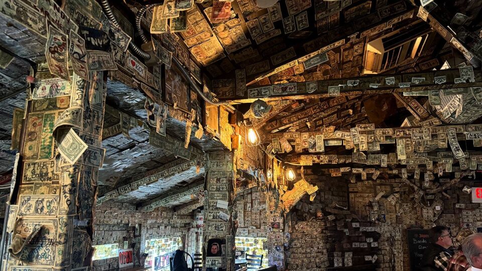 Top to Bottom walls and ceiling covered in dollar bills