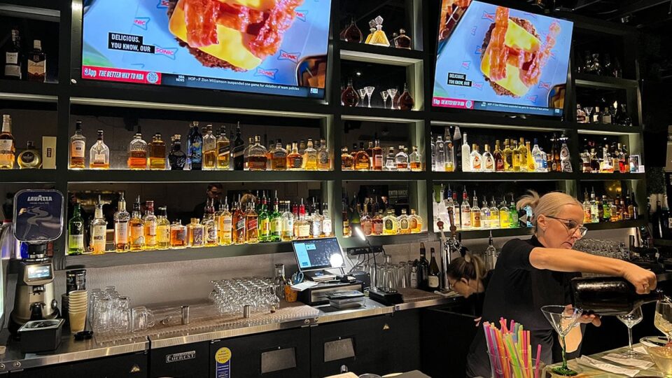Full bar and liquor display inside Beso Restaurant