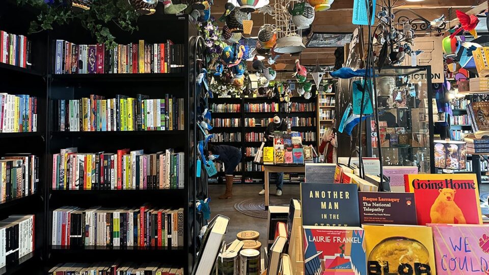 Customers browsing books inside The Writer's Block bookstore in Las Vegas