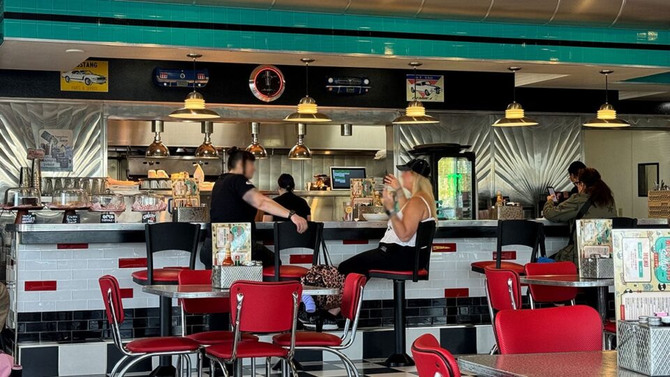 Fiends chatting at the bar over breakfast