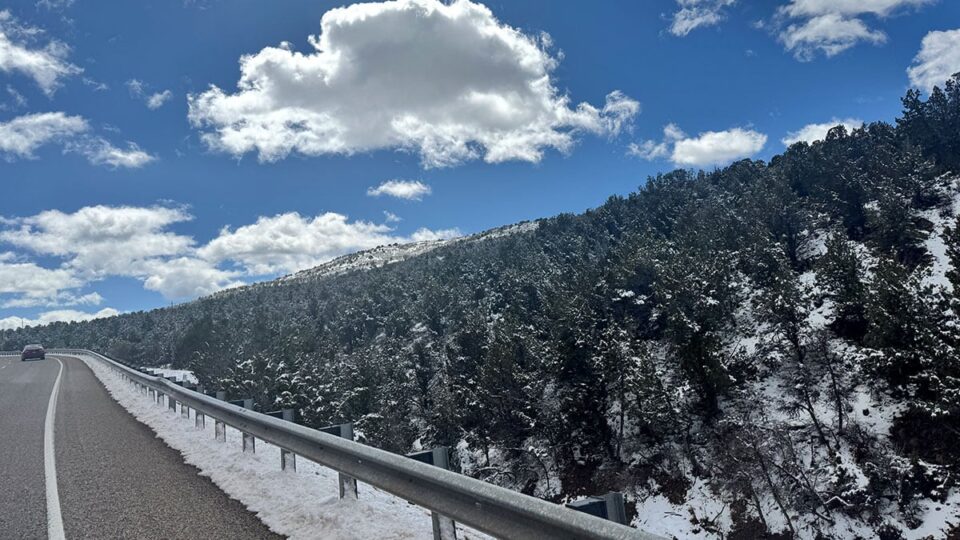 Warm day with leftover snow on the road down to st. george ut