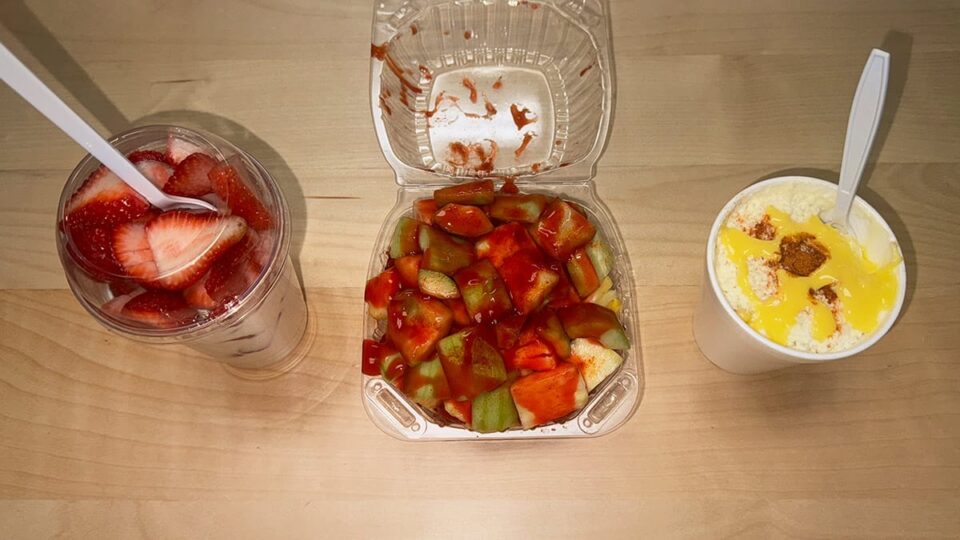 Fresas con crema, fruit with chamoy, and elote at Lokuras Mexican Raspados