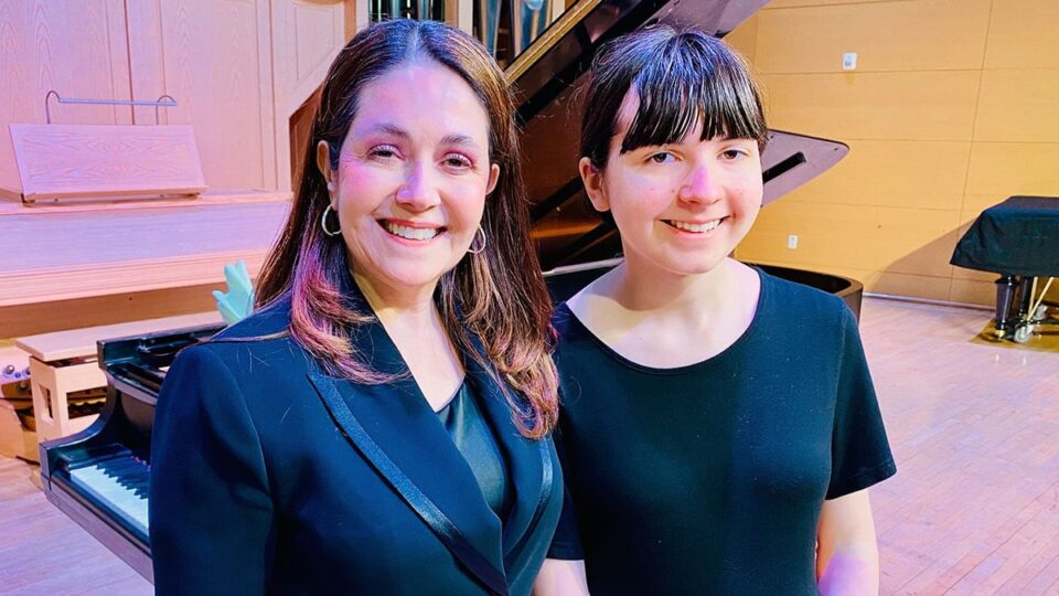 Marta Menendez With Her Student