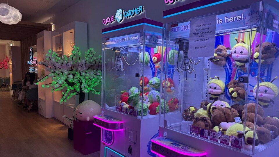 Claw machines filled with plush prizes inside Boba CuCue Las Vegas