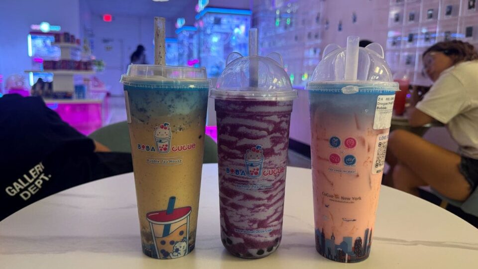 Three colorful Boba CuCue drinks including taro, Cookies and Cream, and Dragon Fruit bubble tea