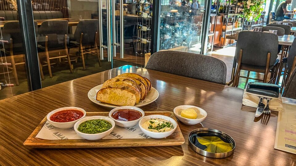 House-made focaccia and dipping sauces at AMARI Italian Kitchen