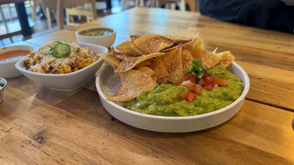 Chips and Guacamole along side Corn Esquites.