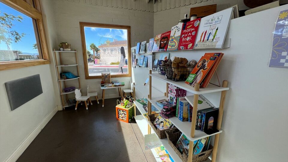 Children’s play area with toys and books inside Dam Roast House & Browder Bookstore.