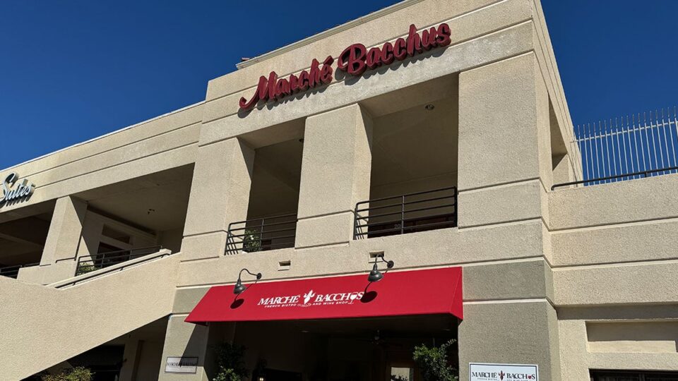 Exterior view of Marché Bacchus restaurant with its front sign and entrance at Desert Shores in Las Vegas.