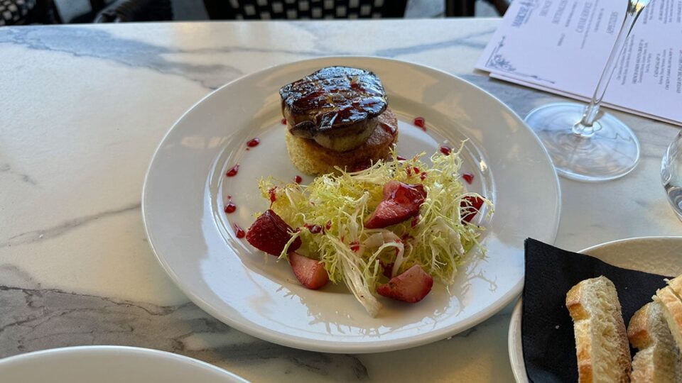 Seared foie gras plated with seasonal clafoutis at Marché Bacchus, served for brunch by the lake.