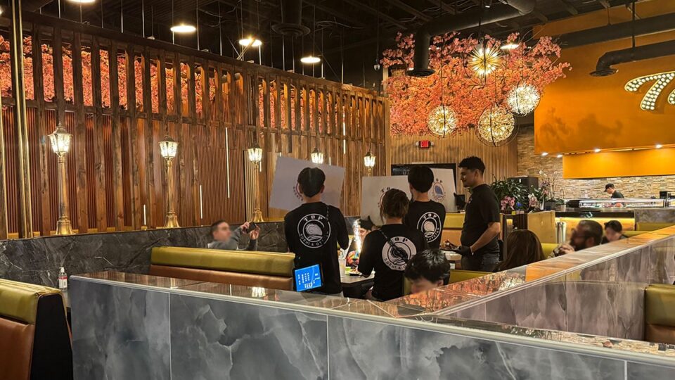 Top Sushi Staff Celebrating a birthday for a guest