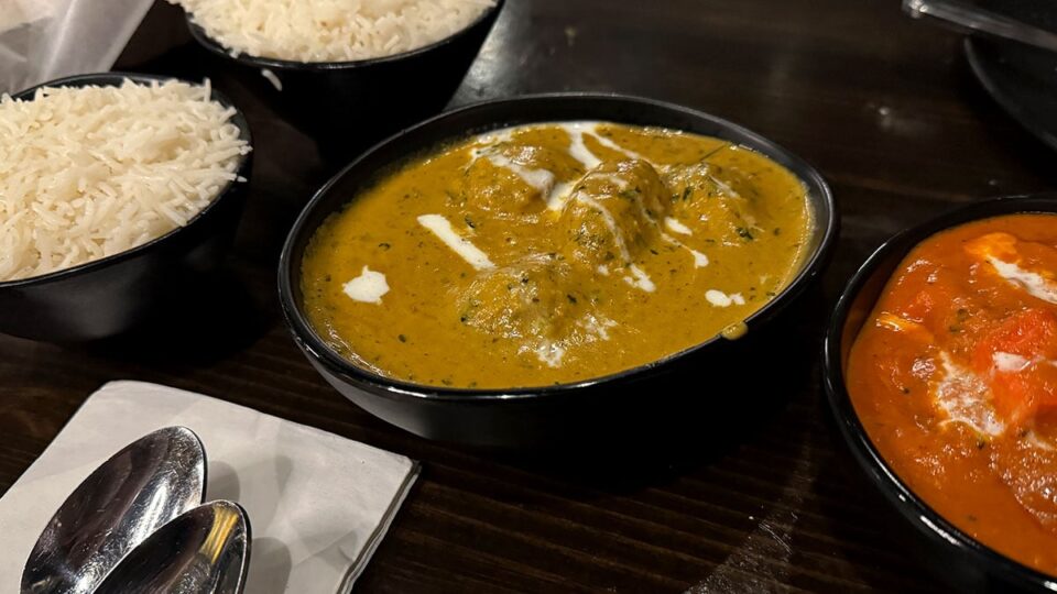 Plate of malai kofta dumplings in creamy cashew onion sauce at Mint Indian Bistro