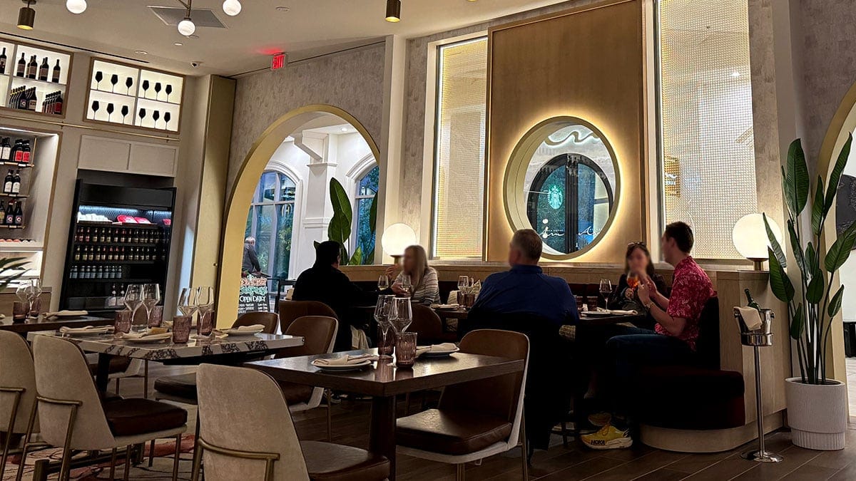 Guests enjoying the cozy and social interior of Wineaux, with comfortable seating and an inviting ambiance.