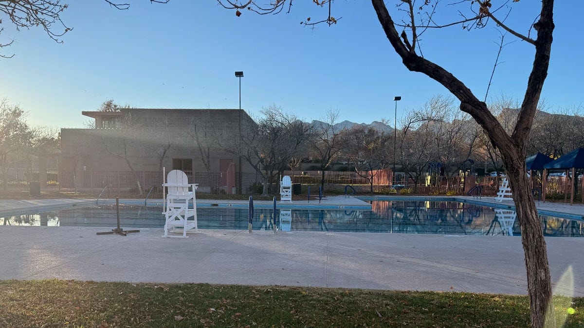Community swimming pool at The Trails Park & Pool in Summerlin, featuring clear water and surrounding deck area