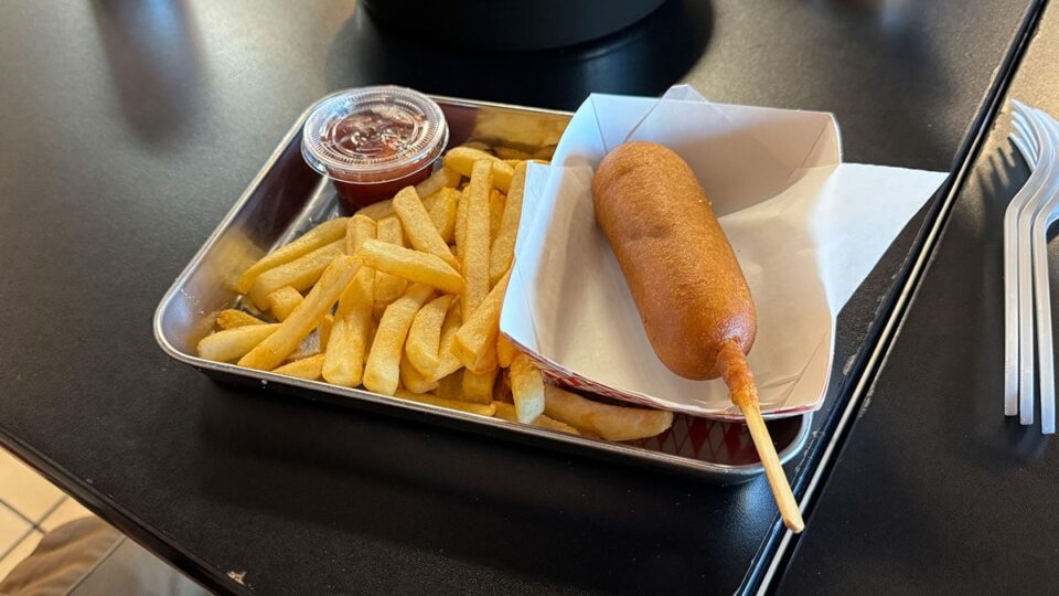 Corn dog with a side of fries served at Buldogis Las Vegas.