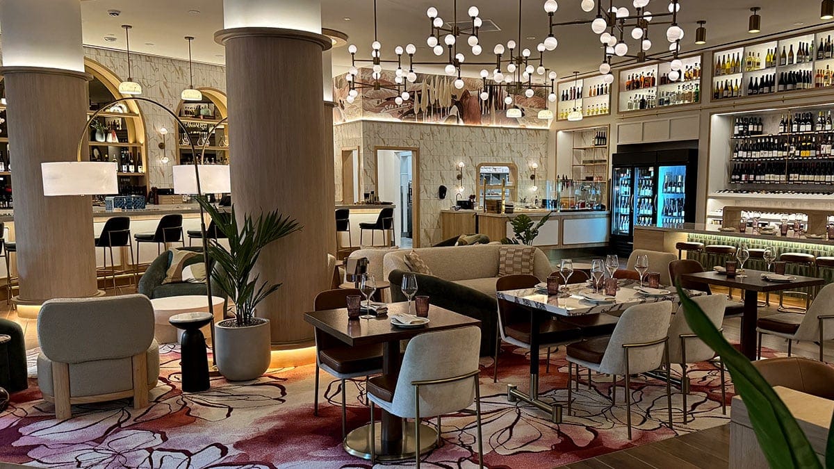 Interior of Wineaux featuring a cozy and stylish dining space with warm lighting, modern finishes, and an inviting ambiance for guests.