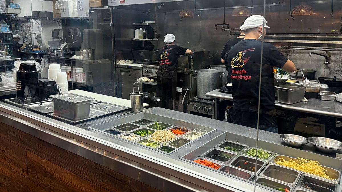 the kitchen at kung fu dumplings with chefs preparing food in summerlin las vegas