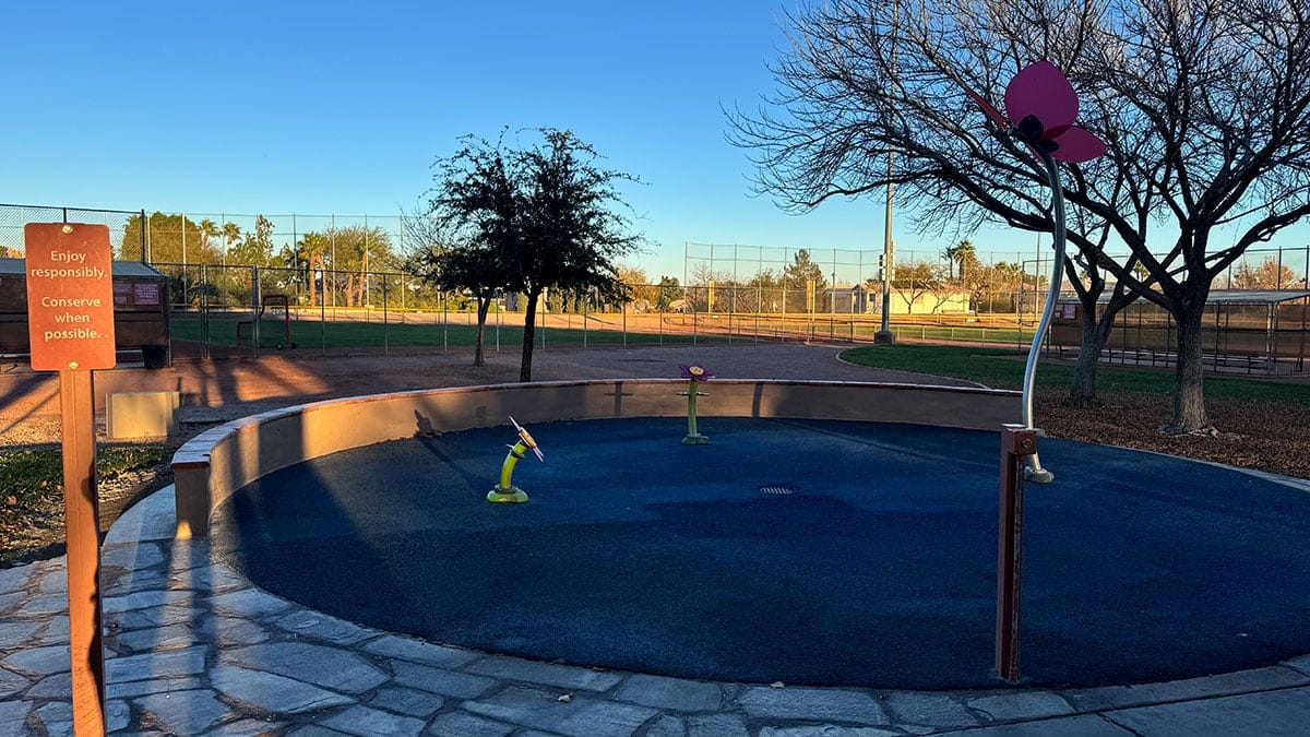 Splash pad at The Trails Park & Pool in Summerlin with water features and open play space, no people visible.