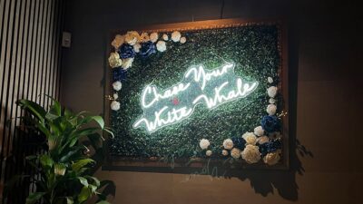 “Chase Your White Whale” signage inside White Whale bar.