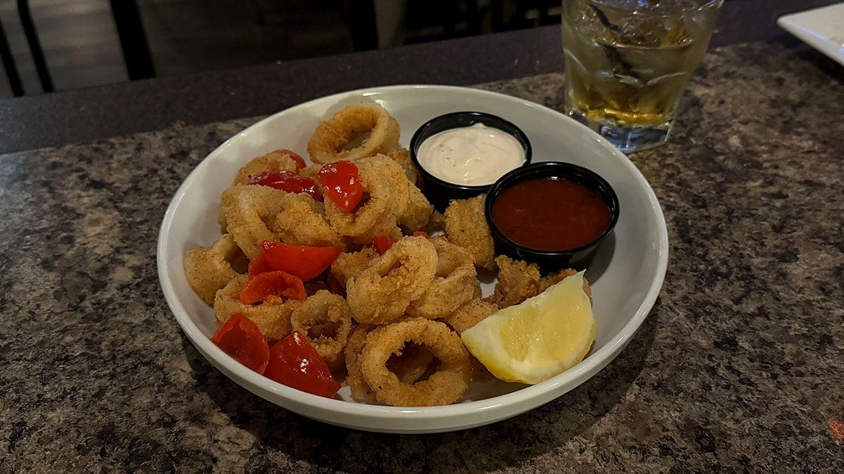 Fried calamari with peppadew peppers and arugula, served with tomato sauce and lemon garlic sauce at Giuseppe’s Bar & Grille in Southwest Las Vegas.