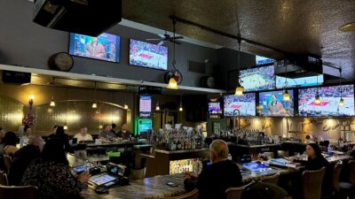 Interior bar view at Giuseppe’s Bar & Grille in Southwest Las Vegas, featuring a full bar and sports-bar atmosphere.