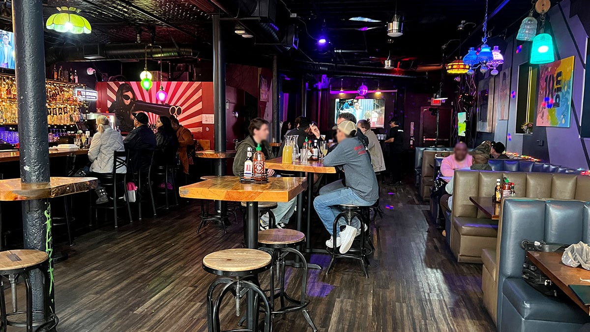 Inside 18bin Downtown Las Vegas featuring modern bar décor, warm lighting, and a cozy lounge vibe.