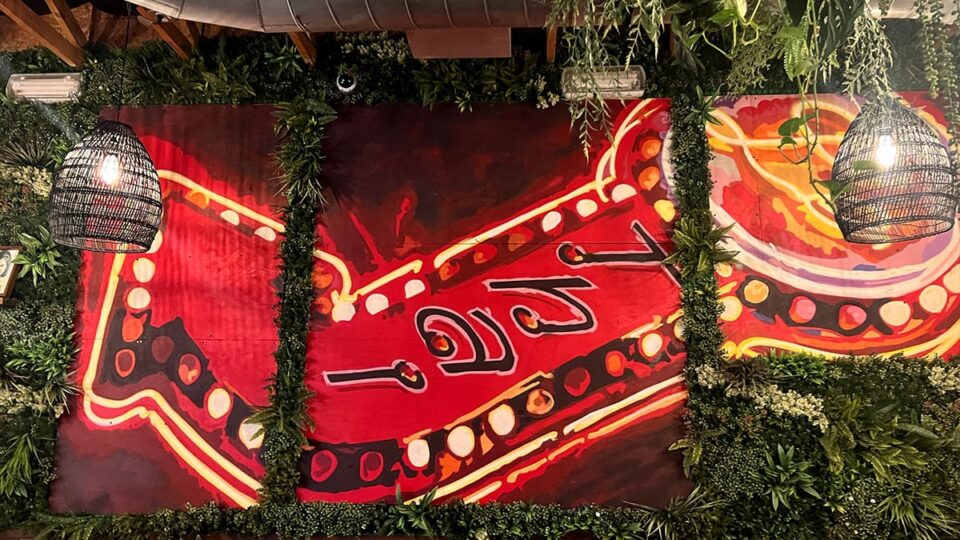 Le Thai Sign Art on the restaurant wall