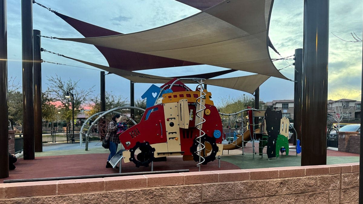 A shaded playground with play equipment at Sagemont Park in the Summerlin area of Las Vegas.