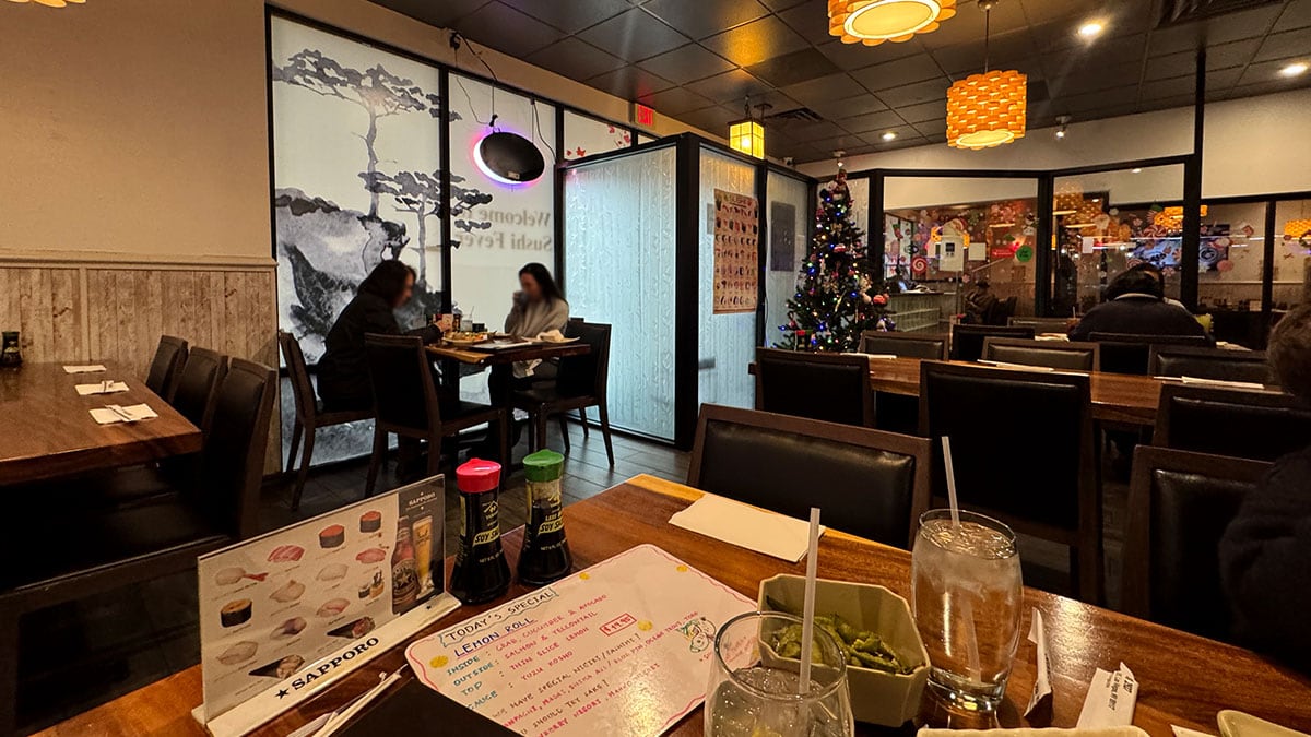 Dining area inside Sushi Fever restaurant in Las Vegas with tables and seating.