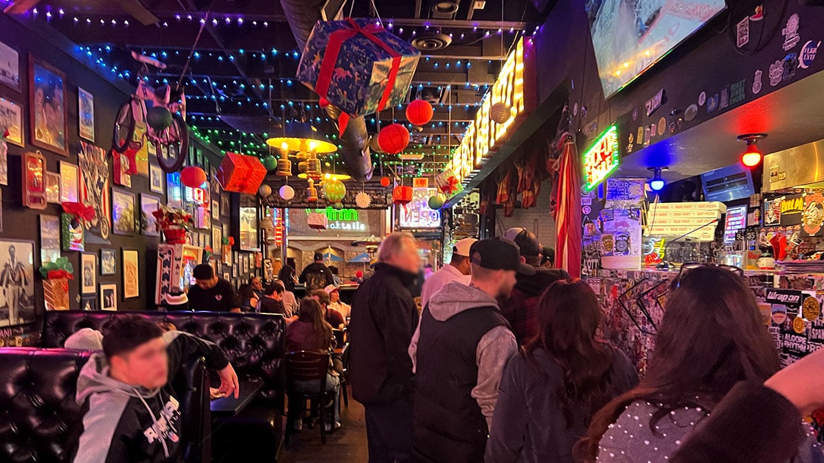 Weekend crowd and lively atmosphere inside Evel Pie on East Fremont Street in downtown Las Vegas.