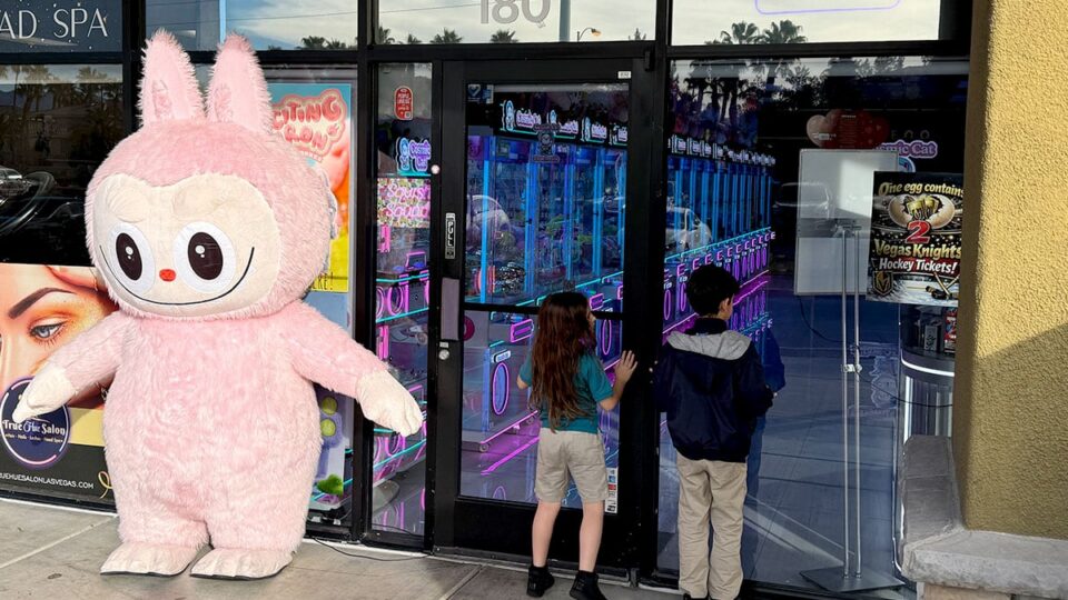 Giant Labubu inflatable welcoming families at Cosmic Cat Claw Arcade in Las Vegas.