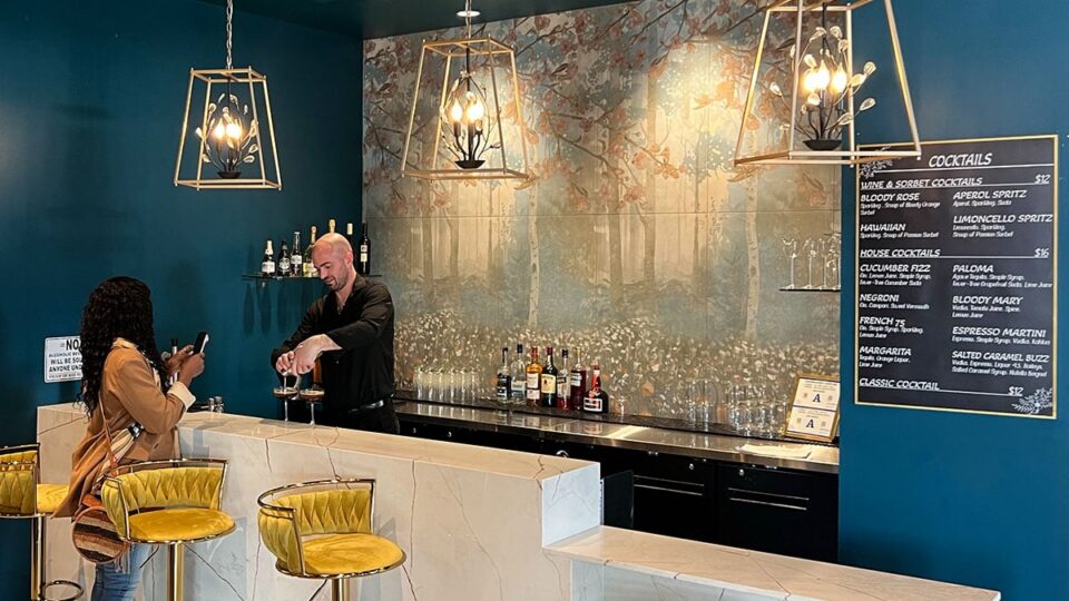 Bar area inside Le Café Central in Chinatown Las Vegas with espresso drinks and cocktail service.