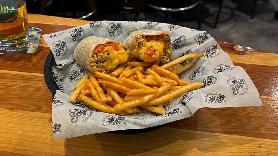 Breakfast burrito with chorizo served at Sagos Tavern with fries on the side.