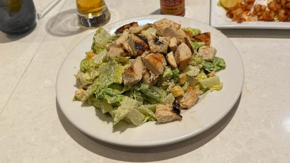 Caesar salad with grilled chicken, parmesan, and croutons at Briggs Oyster Co.