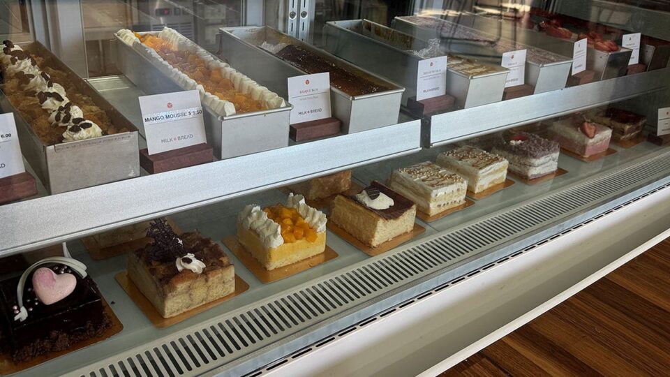 Cakes displayed in the dessert case at Milk Bread LV in Las Vegas.