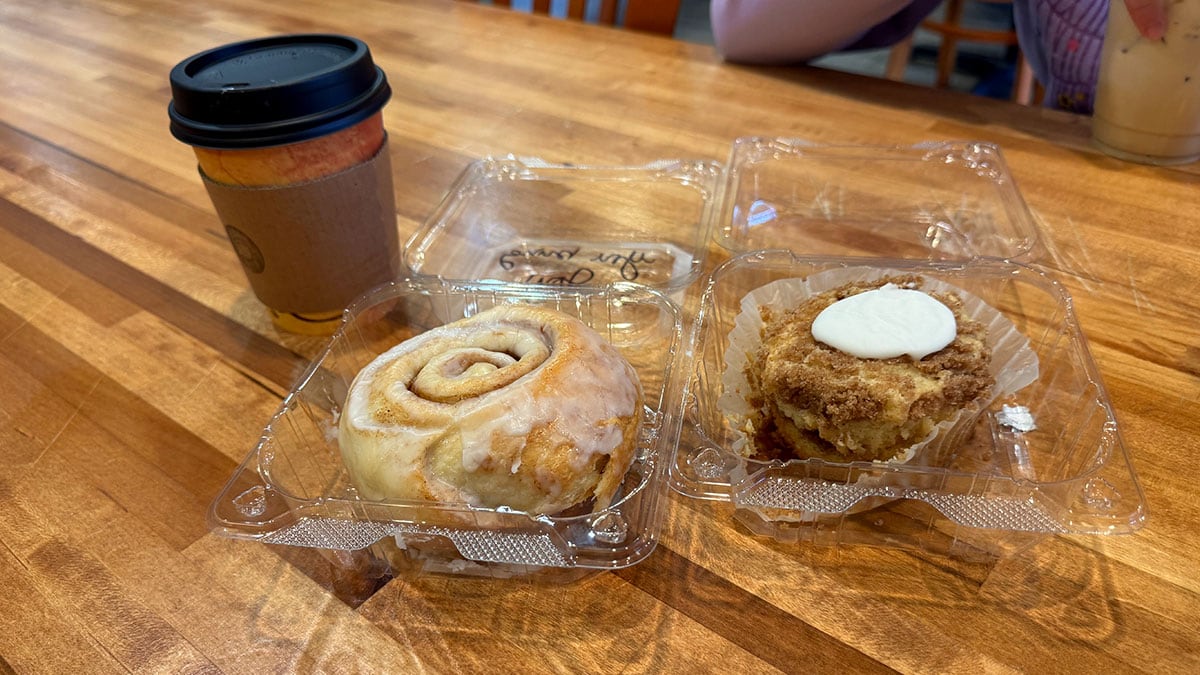 Close-up of a fresh cinnamon roll and slice of coffee cake made in-house at Convo Coffee House in Northwest Las Vegas.