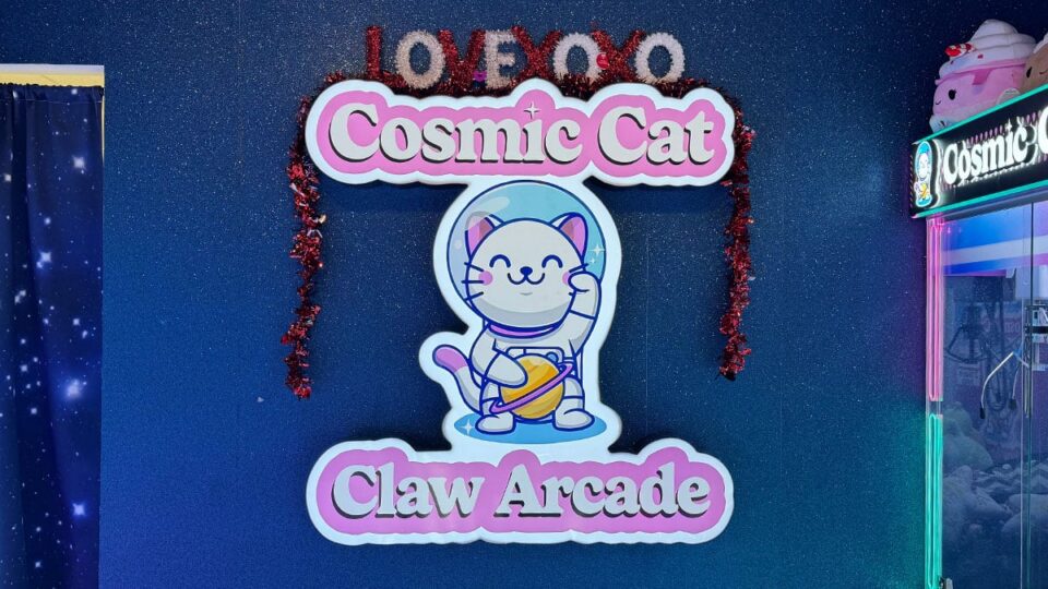 Cosmic Cat Claw Arcade logo wall used for pictures inside the arcade.