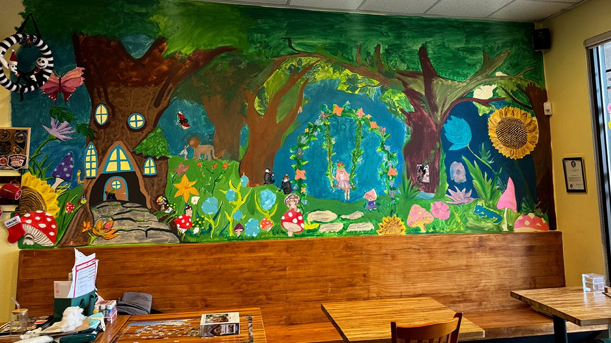 Bright, colorful wall design inside Convo Coffee House enhancing the cozy and welcoming décor.