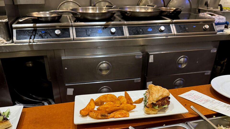 Seafood dishes waiting to be served from the open kitchen at Briggs Oyster Co.