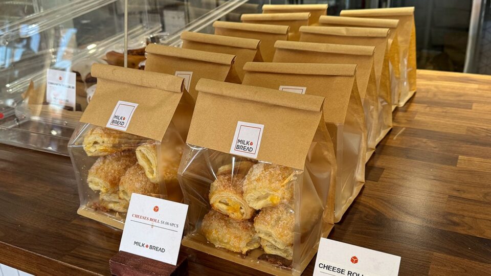 Filipino cheese rolls displayed on the counter at Milk Bread LV.