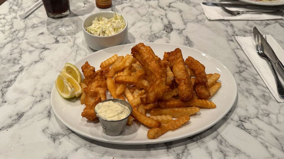 Fish and Chips plate with battered cod, fries, and coleslaw at Du-Par's