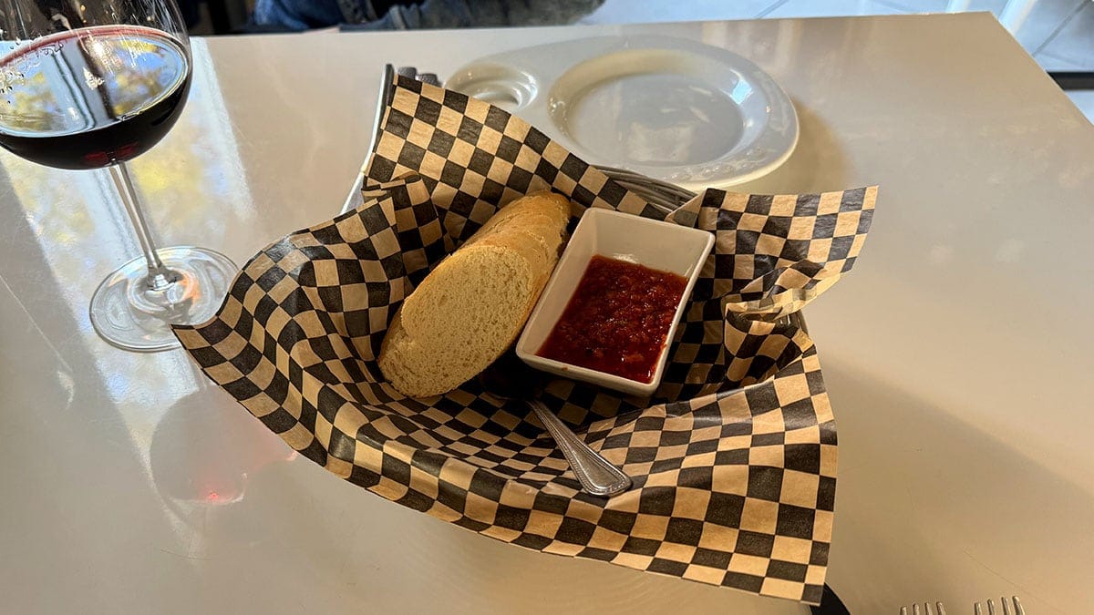 Fresh house-made bread paired with tomato bruschetta at Brunello Italian restaurant in Sun City Summerlin.
