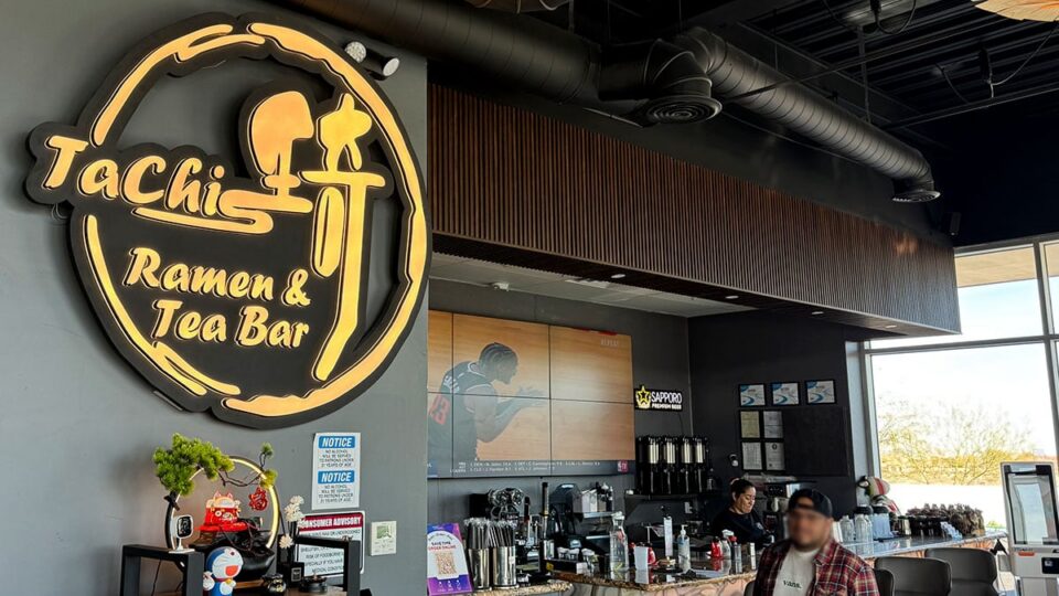 Interior of Tachi Ramen & Tea Bar showing bar seating and drink station