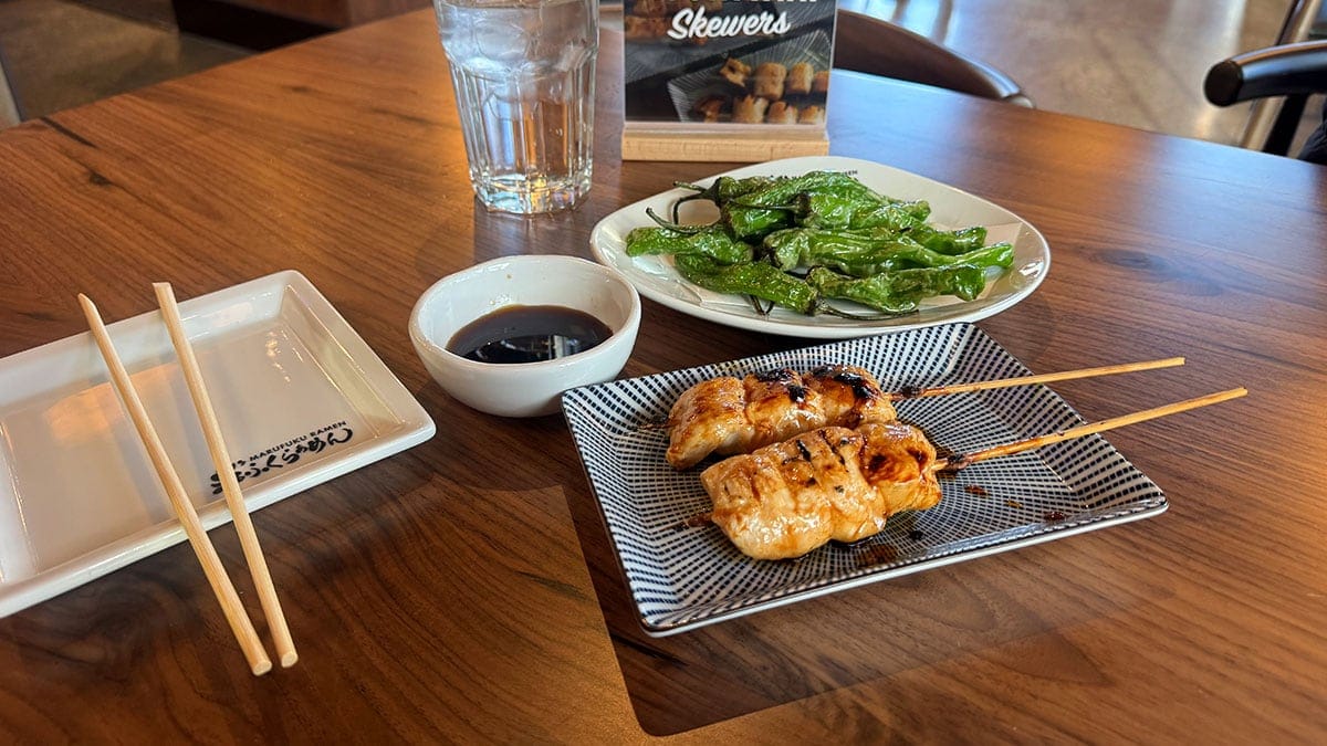 kushiyaki chicken skewers and fried shishito peppers at marufuku ramen in downtown summerlin
