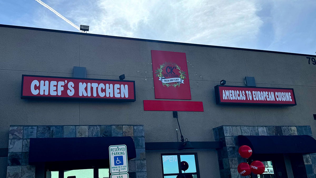 Exterior view of Chef’s Kitchen storefront with modern signage and welcoming entrance.