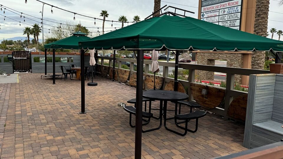 Outdoor patio seating at Exit Zero Coffee with water bowls available for dogs