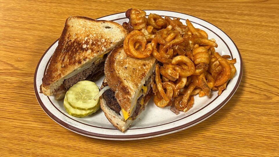 Patty melt with bacon and curly fries at The Blue Skillet Family Restaurant in Las Vegas.