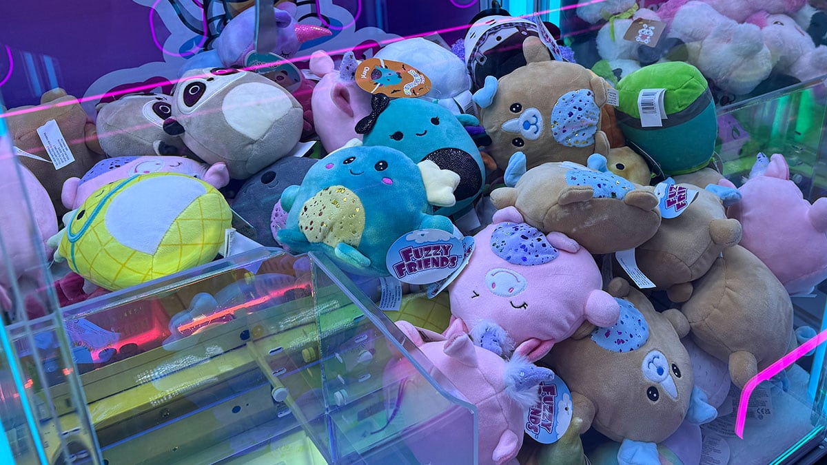 Plush toys inside a claw machine at Cosmic Cat Claw Arcade in Las Vegas.